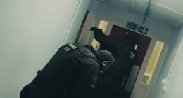 Moment armed officers find three bodies in block of flats