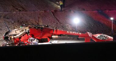 Motorists help lift crashed medical helicopter off pinned passenger