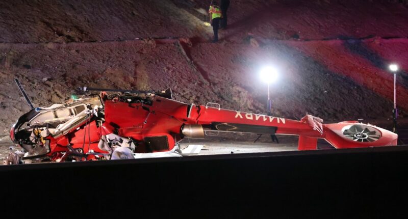 Motorists help lift crashed medical helicopter off pinned passenger