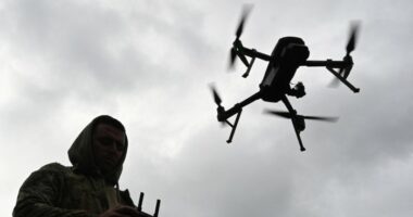 A Ukrainian serviceman operates a drone during a competition that simulates combat conditions