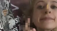 Pro-Palestinian supporter SPITS on poster of Israeli hostages