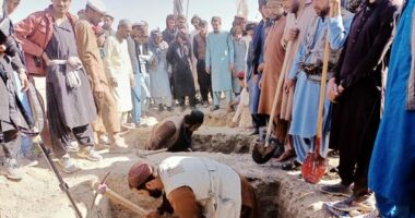 Locals dig graves for people killed in a cross-border airstrike by the Pakistani army in Afghanistan's eastern Paktika province, Saturday, Oct. 18, 2025. (AP Photo/Shafiqullah Mashaal)