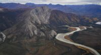 Race against time to build a 211-mile gravel track across America's most extreme frontier for new 'Manhattan Project'... but it could be too late