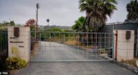 Retail tycoon John Levy is being fined more than $1.4 million over a gate that blocks public beach access among other violations
