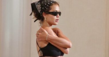 Rita Ora displays her taut abdomen in a crop top and hot pants