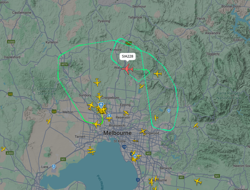A Melbourne flight bound for Singapore is diverting back to Tullamarine airport after witnesses described seeing it flying low and dumping fuel.