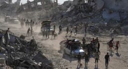 Some Palestinians pack up and move north toward their homes in Gaza after ceasefire goes into effect