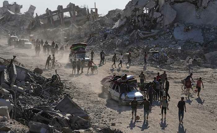 Some Palestinians pack up and move north toward their homes in Gaza after ceasefire goes into effect