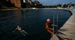 People brave the early morning ahead of the record-breaking heat at Rose Bay's Redleaf Pool in Sydney.