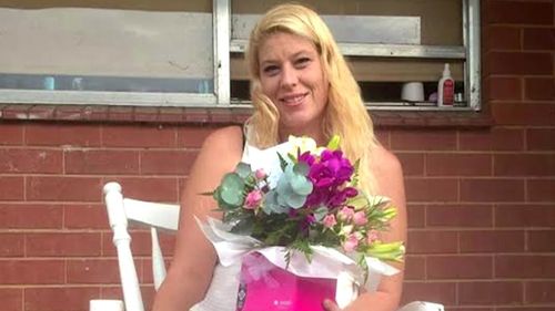 Kristie McBride, 39, was found suffering serious stab wounds and was rushed to Wollongong Hospital in a critical condition.