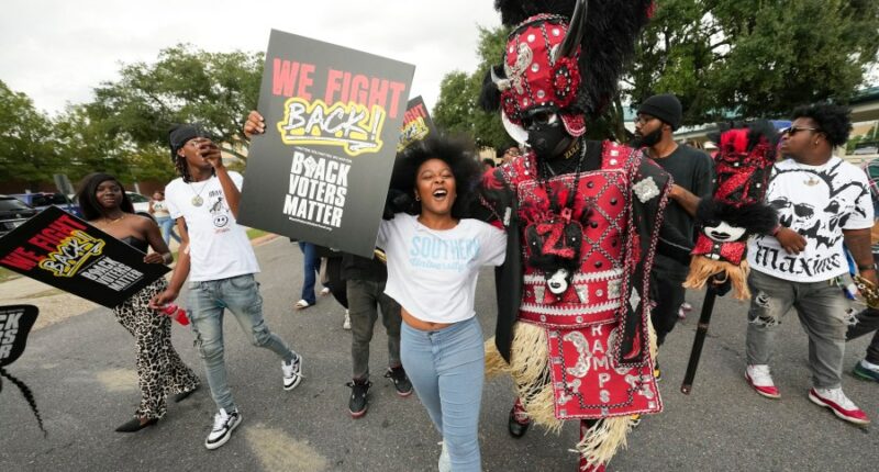 The Latest: Supreme Court set to hear arguments over the Voting Rights Act