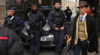 The Louvre detective? Mystery dapper 'detective' in AP photo after the Louvre heist creates social media buzz