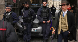 The Louvre detective? Mystery dapper 'detective' in AP photo after the Louvre heist creates social media buzz
