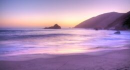 The rare phenomenon that makes some beaches have purple sand