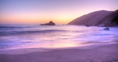The rare phenomenon that makes some beaches have purple sand