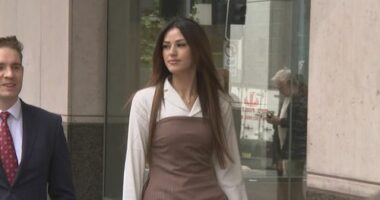 20-year-old Sarah Mouhanna walking to court.