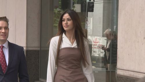20-year-old Sarah Mouhanna walking to court.