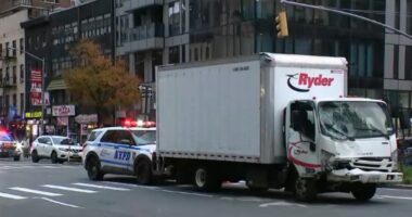 Truck hits parked van in Midtown Manhattan, pushing vehicle onto sidewalk and injuring 9