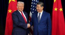 U.S. President Donald Trump greets Chinese President Xi Jinping ahead of a bilateral meeting at Gimhae Air Base on October 30, 2025 in Busan, South Korea.