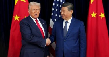 U.S. President Donald Trump greets Chinese President Xi Jinping ahead of a bilateral meeting at Gimhae Air Base on October 30, 2025 in Busan, South Korea.