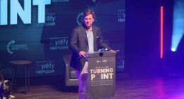 Tucker threatens to beat up student who raised his father's CIA ties