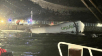 Two dead after cargo plane skids off runway into sea at one of Asia's busiest airports
