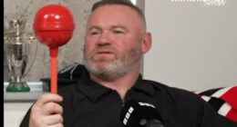 Wayne Rooney is hilariously reunited with giant lollipop from iconic photo with Coleen - as football legend reveals real reason why he bought it