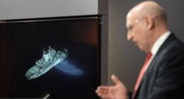 Britain says Russian spy ship is on edge of UK waters, as defense secretary issues warning to Putin