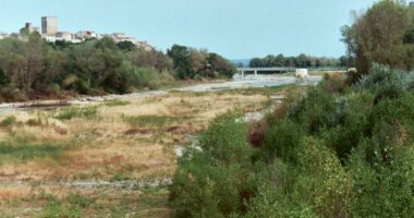 Cyclists survives 130-foot fall