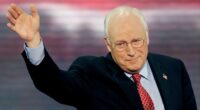 Dick Cheney waves with his right hand while addressing the 2004 Republican National Convention.