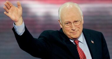 Dick Cheney waves with his right hand while addressing the 2004 Republican National Convention.