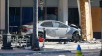 A car that crashed into a local business is shown on Saturday, Nov. 8, 2025, in Tampa, Fla.  (Jefferee Woo/Tampa Bay Times via AP)