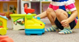 Child playing at a childcare centre stock image