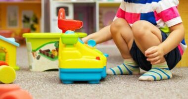 Child playing at a childcare centre stock image