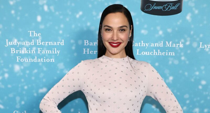 Gal Gadot looks sensational in a figure-hugging sequinned gown as she attends Beverly Hills charity bash - while tensions with Snow White co-star Rachel Zegler rumble on
