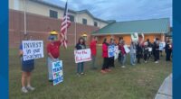 'It's time for action': Clay County teachers rally at board meeting, demanding pay raises