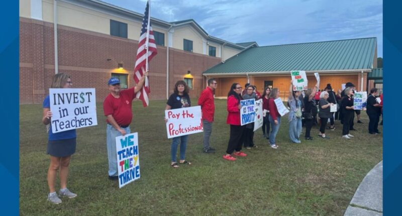 'It's time for action': Clay County teachers rally at board meeting, demanding pay raises