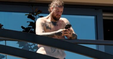 Jelly Roll is seen enjoying the sun on his hotel balcony in Sydney