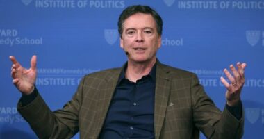 FILE - Former FBI director James Comey gestures while speaking at Harvard University's Institute of Politics' JFK Jr. Forum in Cambridge, Mass., Feb. 24, 2020. (AP Photo/Charles Krupa, File)