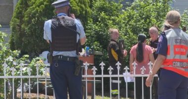 Police and animal control standing outside a home in Doonside after a dog attack that left a man seriously injured.
