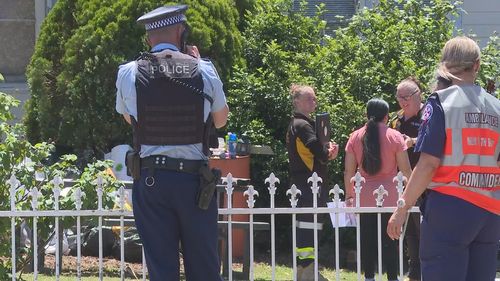 Police and animal control standing outside a home in Doonside after a dog attack that left a man seriously injured.