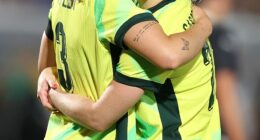Matildas defender Ellie Carpenter embraces Winonah Heatley during their match against New Zealand