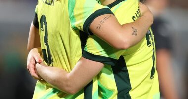 Matildas defender Ellie Carpenter embraces Winonah Heatley during their match against New Zealand