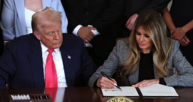 Melania signs executive order alongside Trump