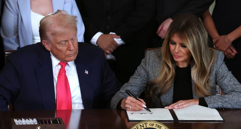 Melania signs executive order alongside Trump