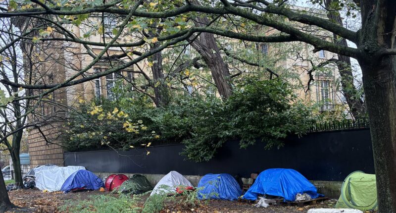 Migrant shanty town appears outside one of London's most iconic homes
