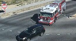 Moment reckless driver, 20, cuts off fire truck and crashes into it