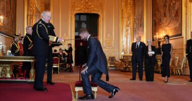 'Not bad for a boy from the east end!':  David Beckham hails 'proudest moment of his life' as he is FINALLY handed much longed-for knighthood by Charles (wearing suit designed by wife Victoria, inspired by the very stylish King)