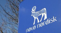 Novo Nordisk logo featuring a stylized blue bull and company name on a large blue sign.