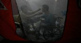 One photo captures tenderness amid chaos as super typhoon hits battered nation